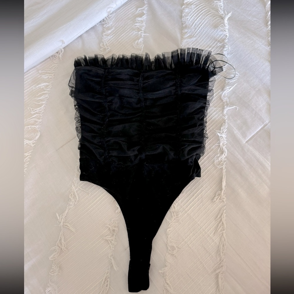 Strapless black bodysuit with ruffles